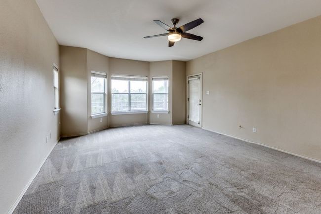 Unfurnished room with carpet floors, a ceiling fan, and baseboards | Image 17