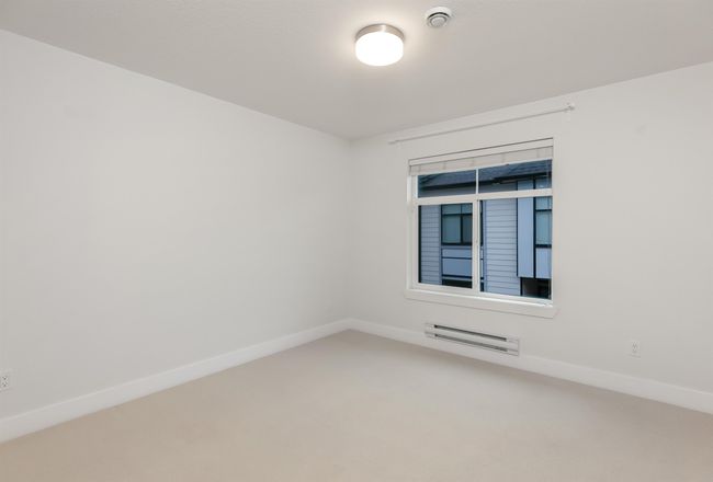 Carpeted empty room featuring baseboards | Image 22