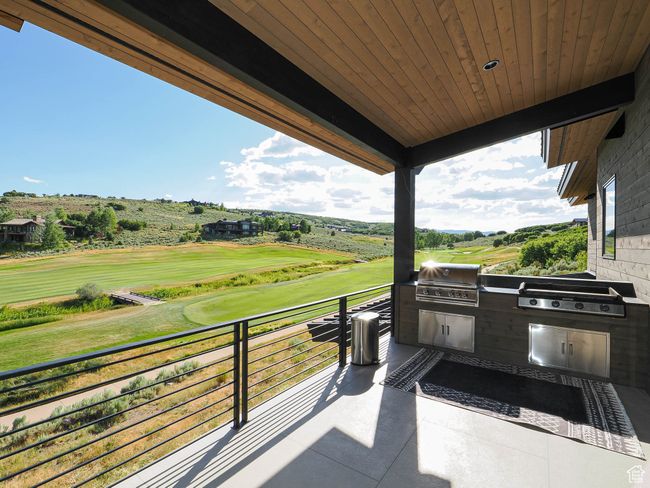 Patio / terrace featuring an outdoor kitchen and golf course view | Image 14