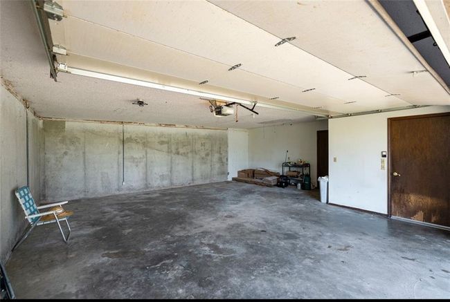 Garage featuring a garage door opener | Image 21