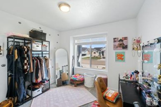 Bedroom featuring a closet | Image 23
