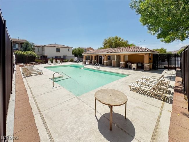 Community pool with a patio area | Image 29