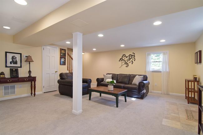 Living room with baseboards, visible vents, light colored carpet, and recessed lighting | Image 18