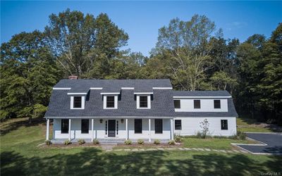 View of front of property featuring a porch and a front lawn | Image 1