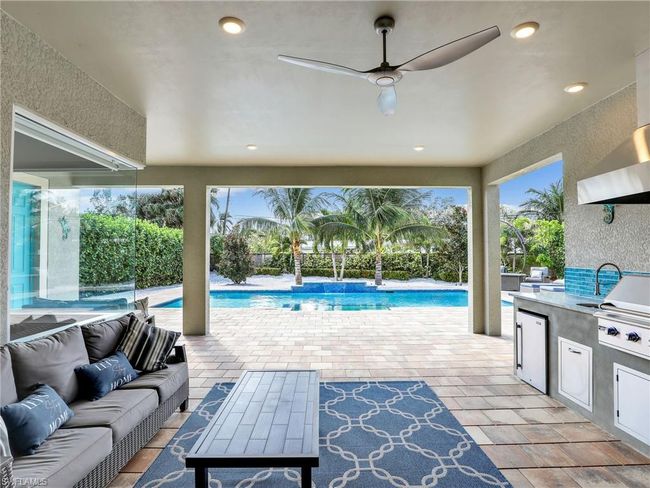View of patio / terrace featuring outdoor lounge area, ceiling fan, and an outdoor kitchen | Image 38
