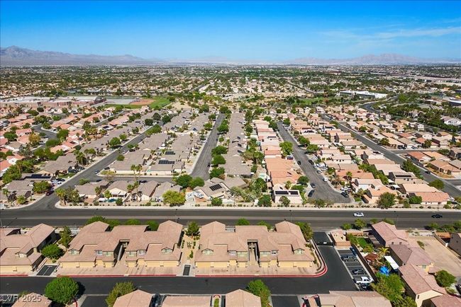 Aerial view of property and surrounding area with a mountainous background and nearby suburban area | Image 47