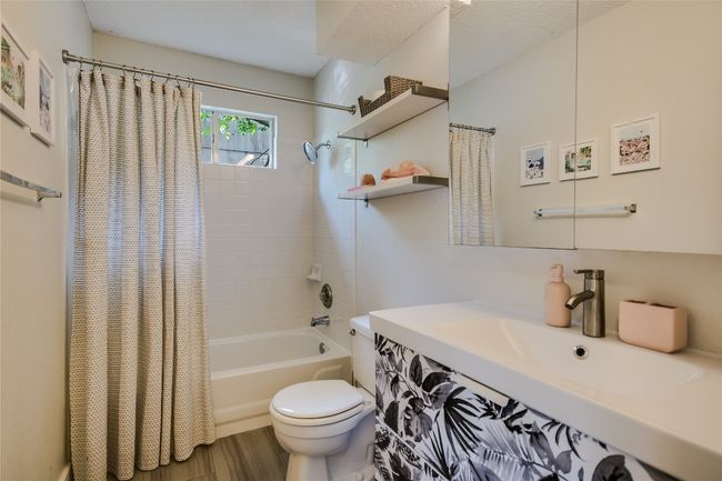 Another full bathroom located between the secondary bedrooms. | Image 15