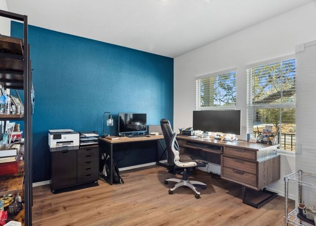 Home office featuring light wood-type flooring and baseboards | Image 20