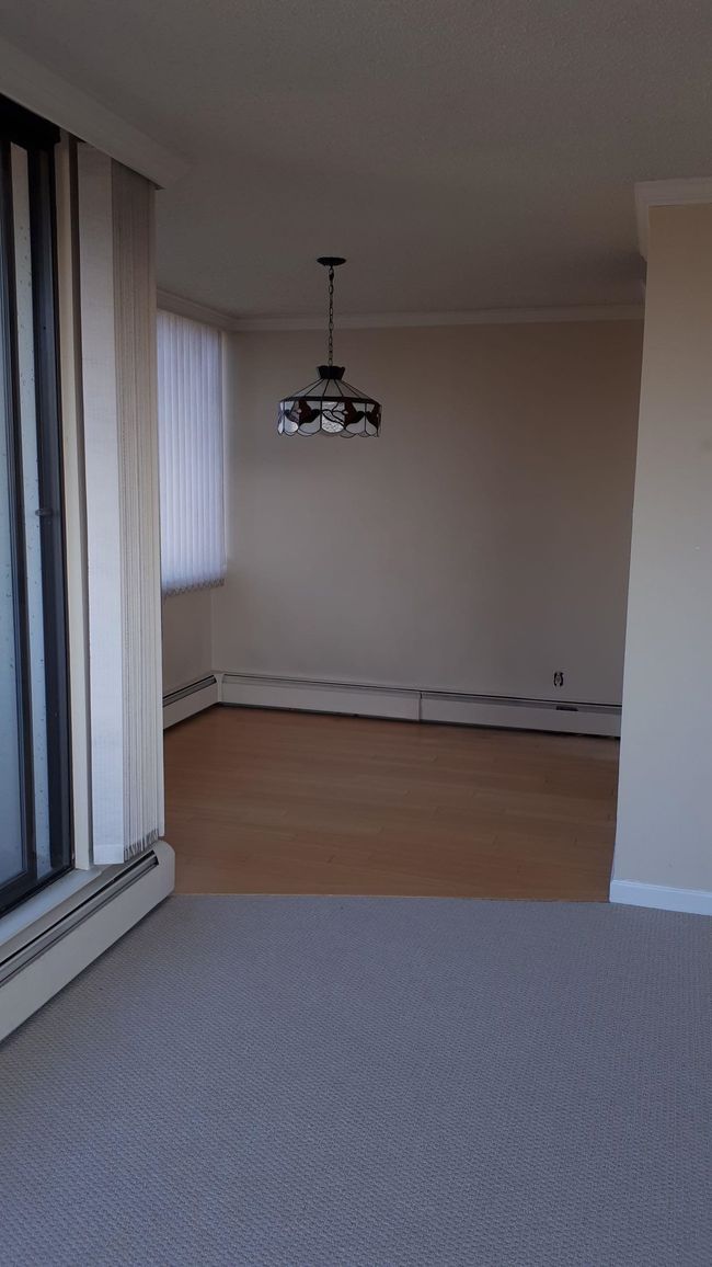 Empty room featuring a baseboard radiator and ornamental molding | Image 13