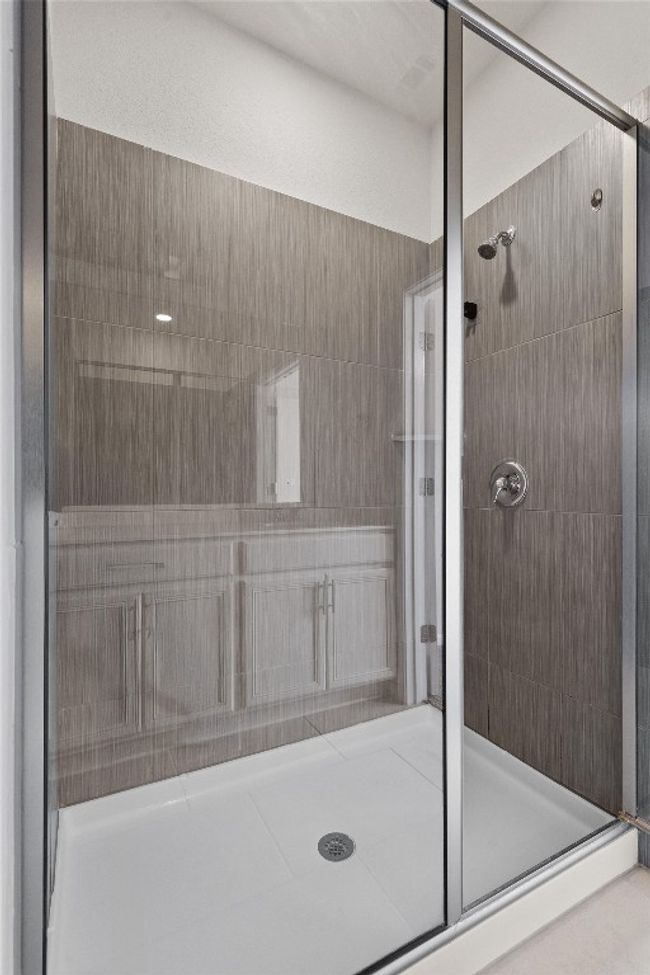 Bathroom with a stall shower | Image 20