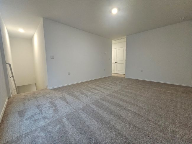 Carpeted spare room with baseboards | Image 13