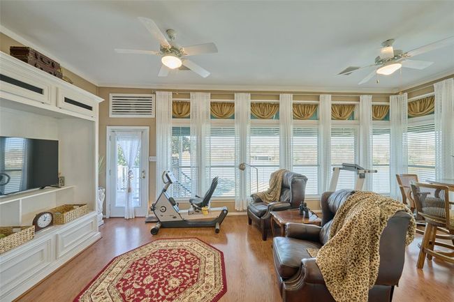 Another view of the sunroom, door leads to the upper deck | Image 24