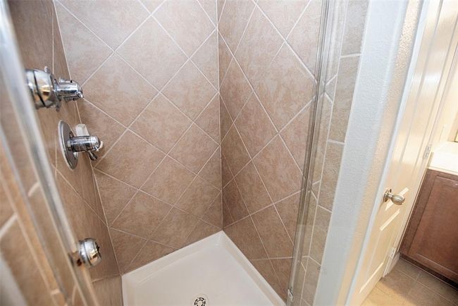 There is a spacious walk in shower as well. | Image 20