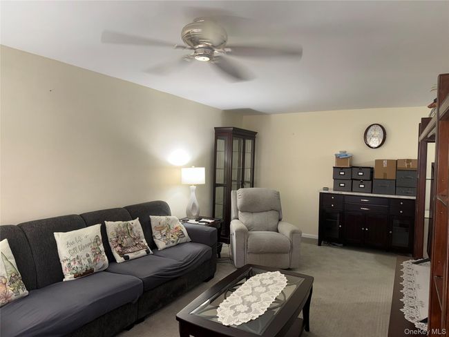 Living room featuring carpet and ceiling fan | Image 6