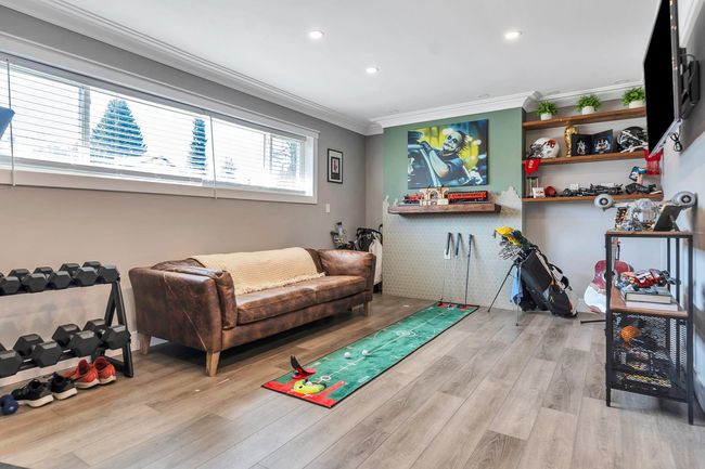 Game room featuring recessed lighting, wood finished floors, and crown molding | Image 16