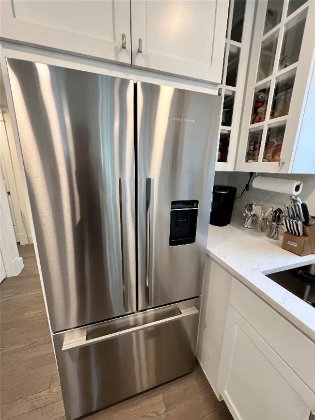 Sleek stainless steel french door fridge with a convenient water and ice maker | Image 7