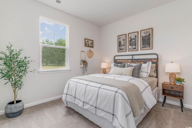Carpeted bedroom with baseboards | Image 16