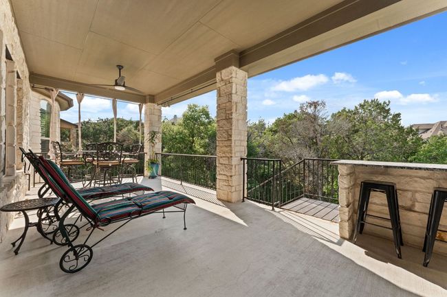 View of patio / terrace with a ceiling fan, outdoor dining space, and a balcony | Image 22