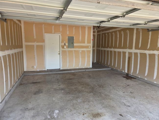 Garage featuring electric panel | Image 6
