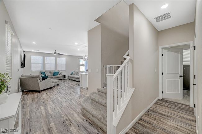Staircase featuring wood finished floors, recessed lighting, ceiling fan, and baseboards | Image 8