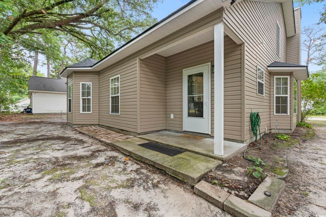 Doorway to property featuring a patio | Image 15