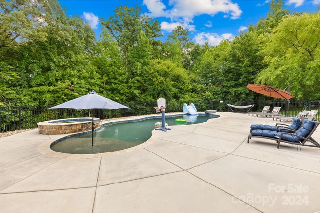 Pool area with plenty of space for lounging and entertaining | Image 34