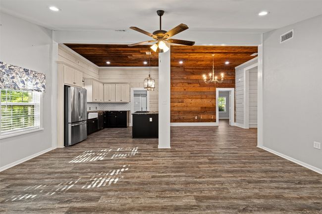 Kitchen featuring visible vents, open floor plan, freestanding refrigerator, and a wealth of natural light | Image 17