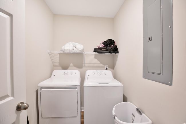 Laundry area with washing machine and dryer and electric panel | Image 9