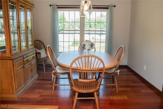 Dining space with dark wood-style flooring | Image 18