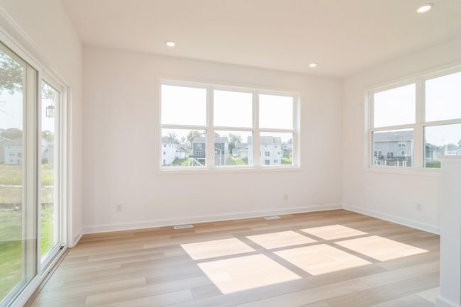 (Photo of a decorated model, actual homes finishes will vary) The kitchen overlooks the morning room and great room. | Image 6