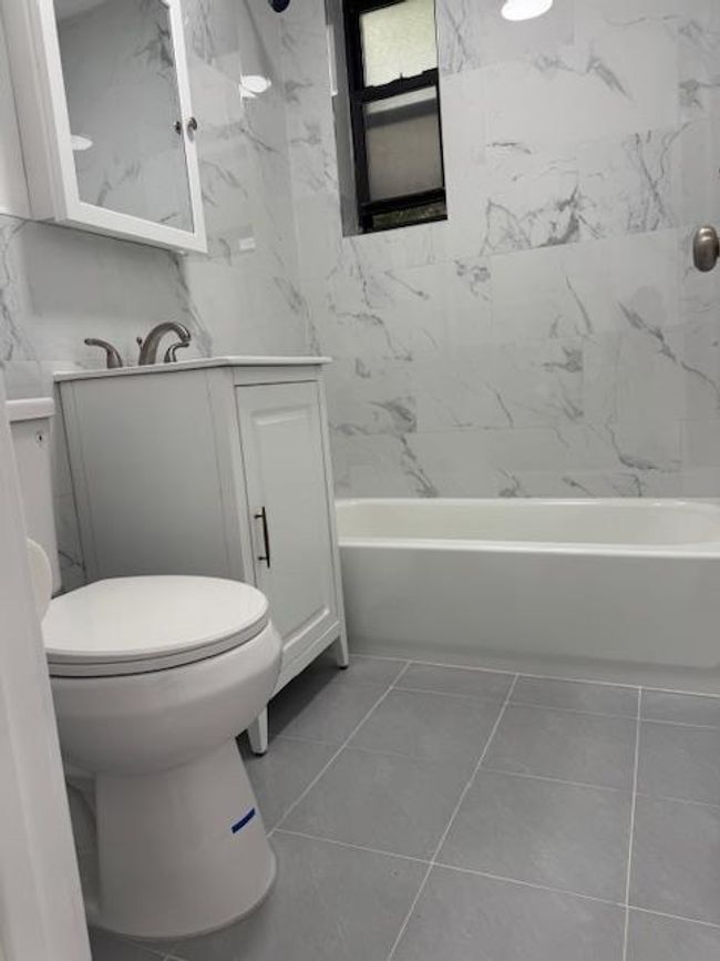 Full bath featuring vanity and washtub / shower combination | Image 6