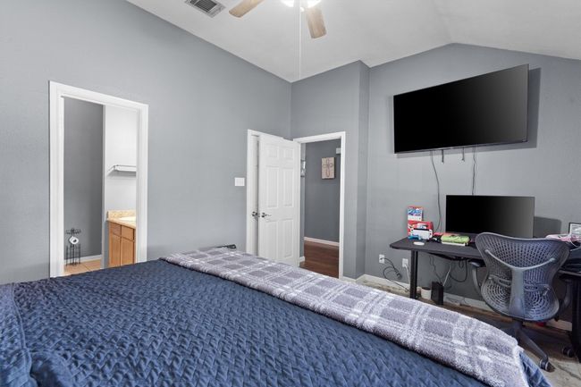 Bedroom featuring a lofted ceiling | Image 14