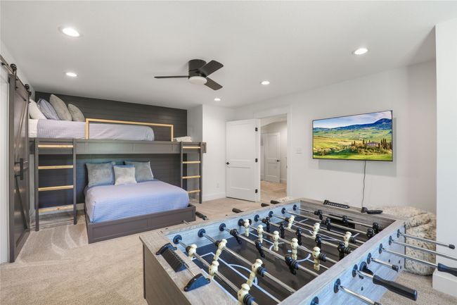 Carpeted bedroom with recessed lighting, a ceiling fan, baseboards, and a barn door | Image 27