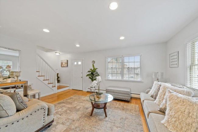 Living room with recessed lighting, plenty of natural light, stairway, and light wood-type flooring | Image 22