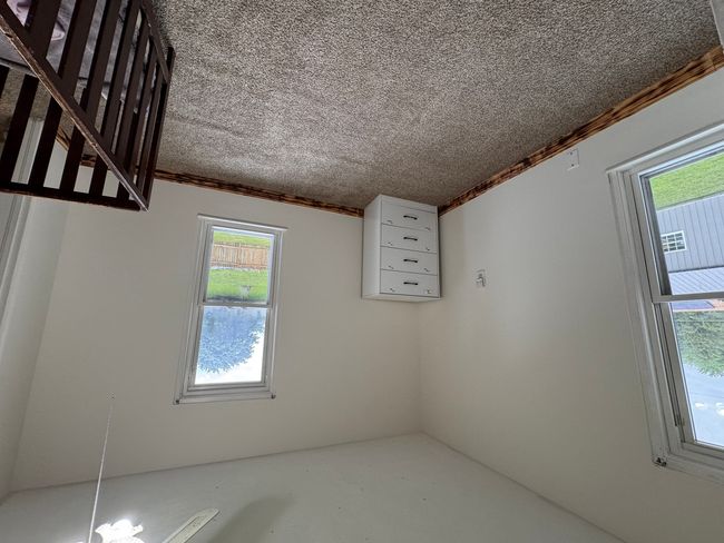 Hallway view, door on the right is the 1st bedroom | Image 22