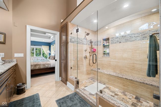 bathroom featuring recessed lighting, connected bathroom, vanity, a stall shower, and tile patterned flooring | Image 43