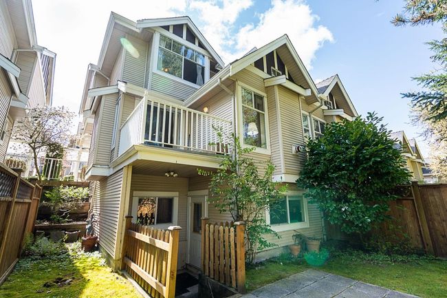 Back of house with a balcony and a fenced backyard | Image 29