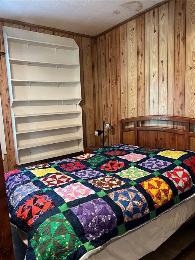 Bedroom with wood walls | Image 30