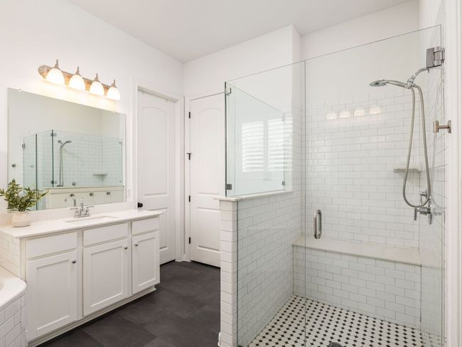Full bath featuring a shower stall and vanity | Image 11
