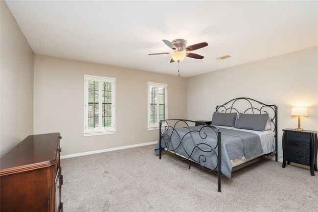 Another spacious secondary bedroom offers flexibility for any need—comfortable and bright, with ample closet space and natural light. | Image 30