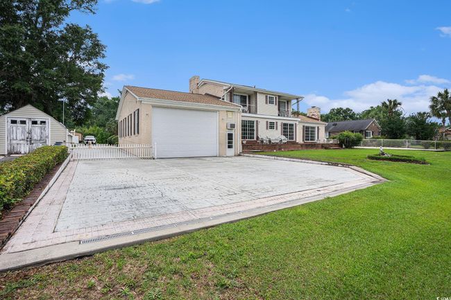 Back of house with an attached garage and driveway | Image 33