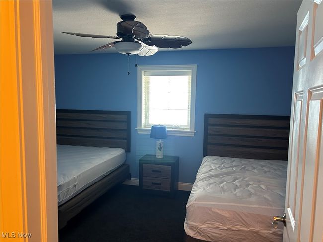 Bedroom with baseboards and a ceiling fan | Image 6