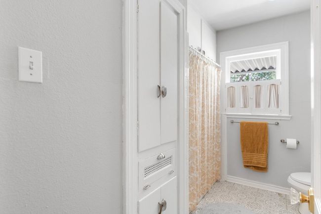 Bathroom features large linen closet next to tub/shower | Image 19