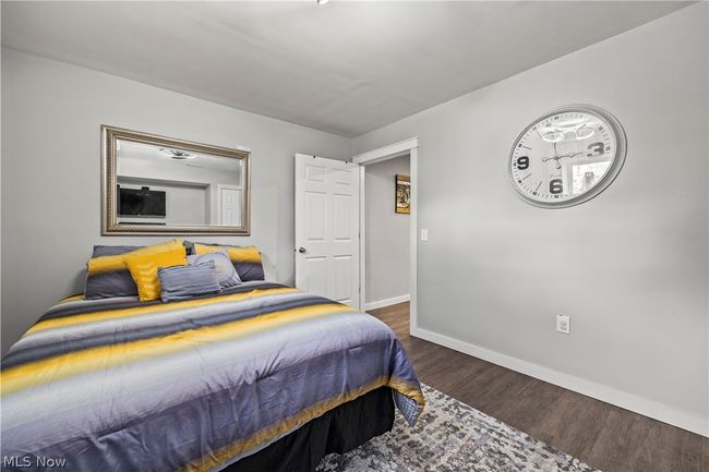 Bedroom featuring dark hardwood / wood-style flooring | Image 40
