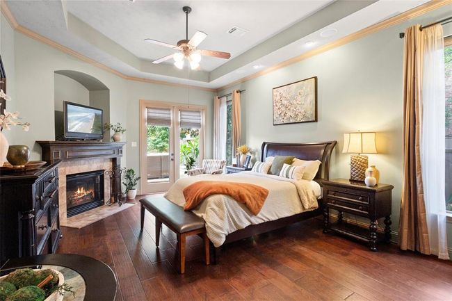 Primary bedroom will hold all your large furniture with plenty of room to move around.Imagine this view of your cozy bedroom fireplace and walk out the double doors to a sitting area with an outside fire. | Image 15