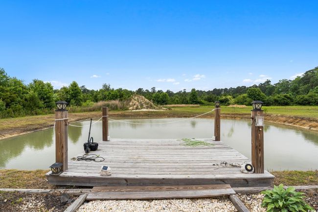Dock area featuring a water view | Image 32