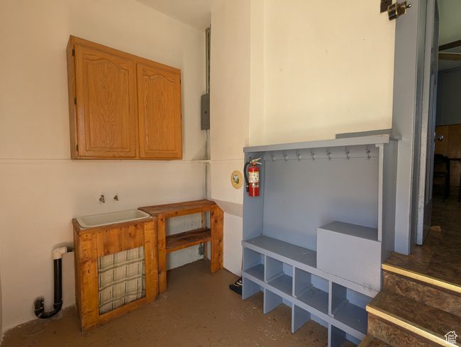 Interior space featuring concrete floors and a sink | Image 14