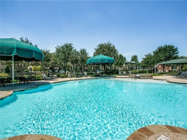 Community pool featuring a gazebo and a patio area | Image 26
