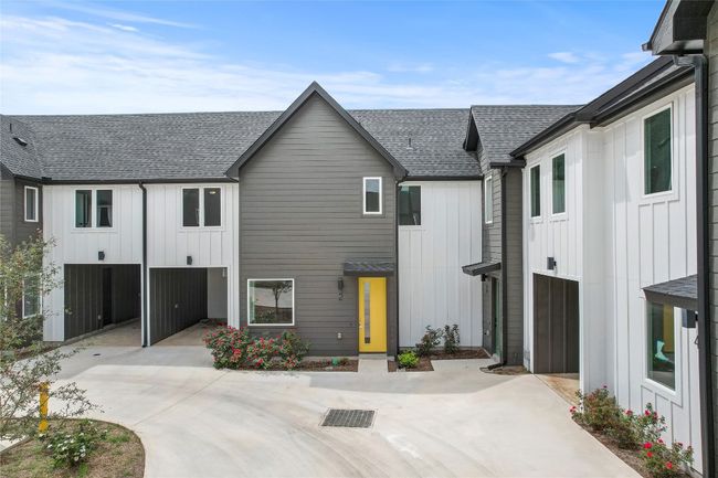 Modern farmhouse featuring a shingled roof and board and batten siding | Image 5