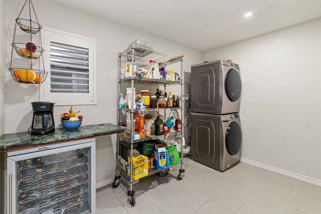 Utility/Laundry room when previously furnished - lots of room and functionality to make it your own space | Image 21